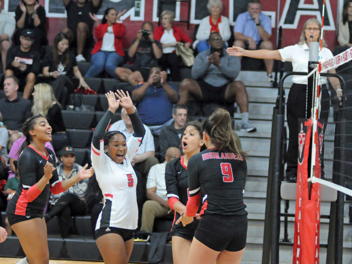 Lake Highland Prep players (from left) Natalie Harris, Nakayla "Suge" James, Kiersten Bevelle and Jennifer Cen celebrate a Bevelle kill against Boca Raton St. Andrew's.